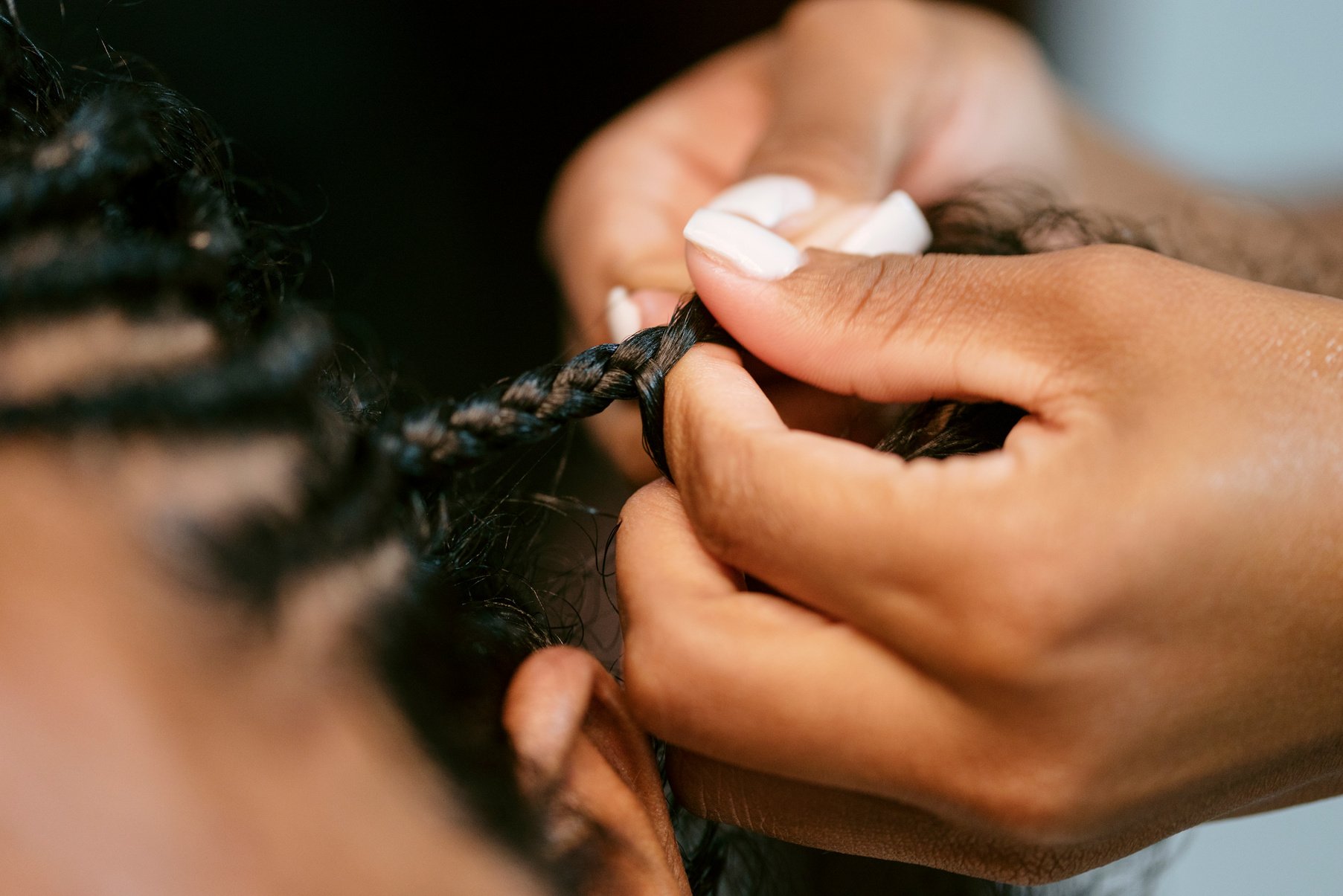 Man with Curly Hair Getting Braids